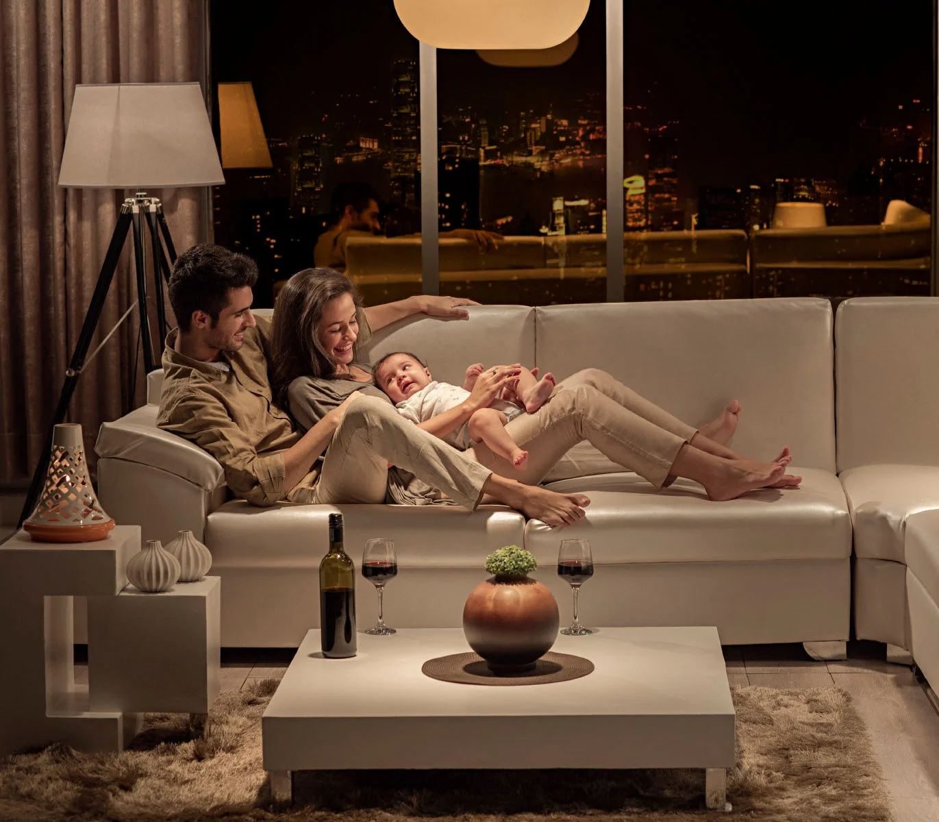 Family relaxing in luxury living room